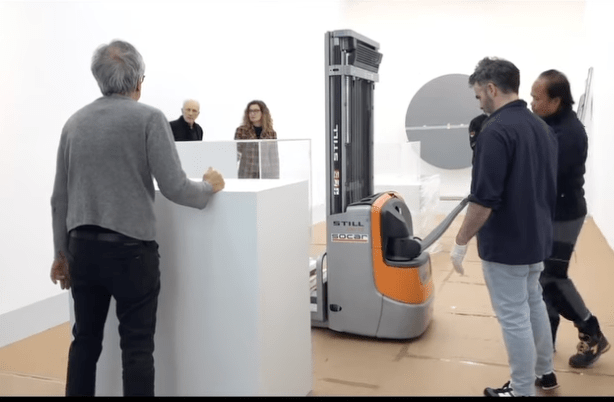 installation view with gallerists and artists